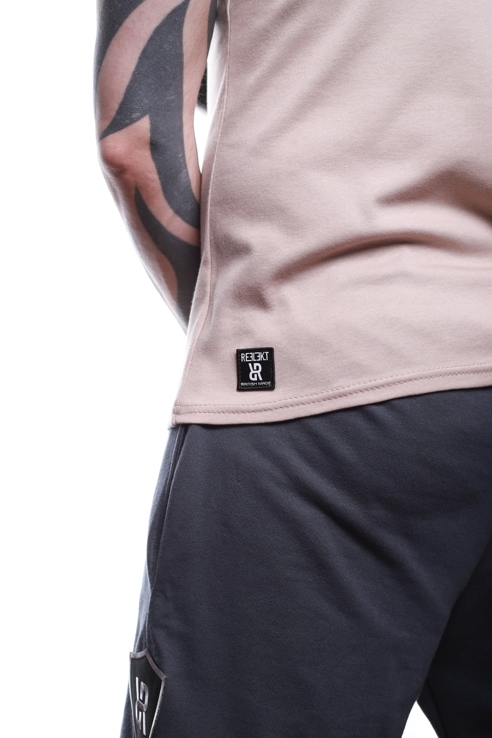 Back insignia badge on Stone‑coloured REFLEKT Heritage vest.