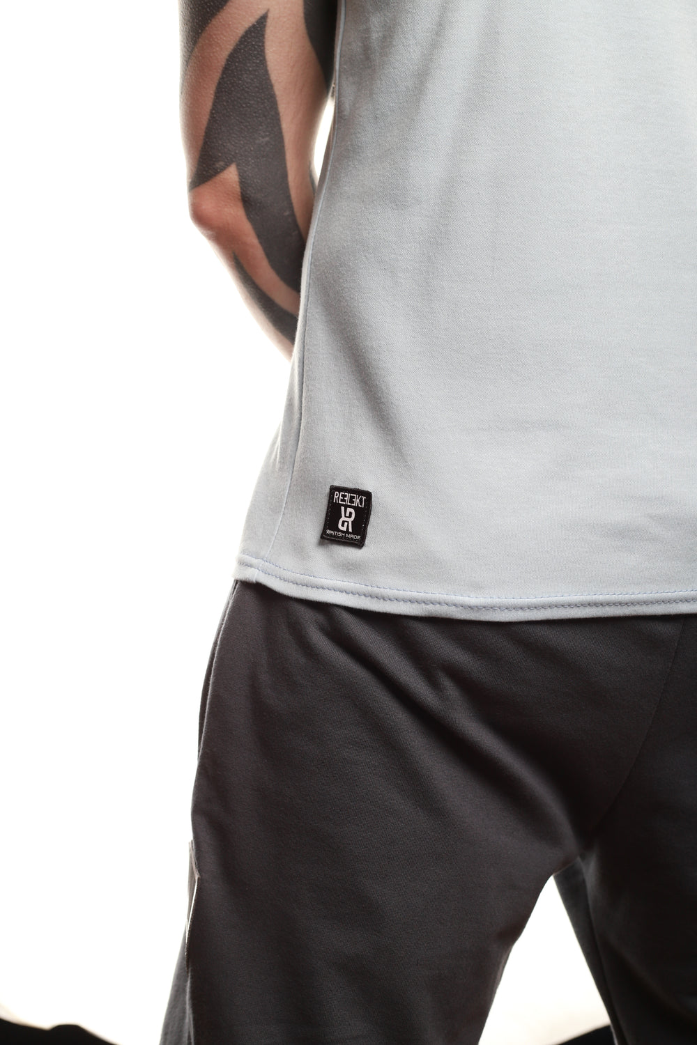 Back insignia patch on Sky‑coloured REFLEKT Heritage vest.