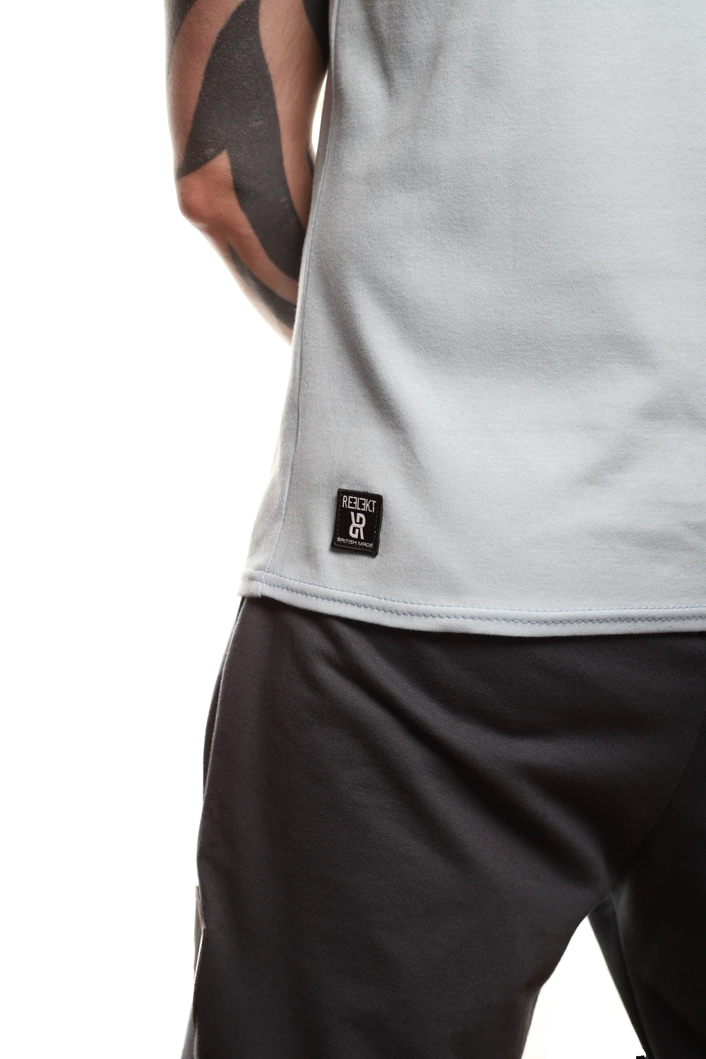 Insignia patch on Sky‑coloured REFLEKT blank vest.