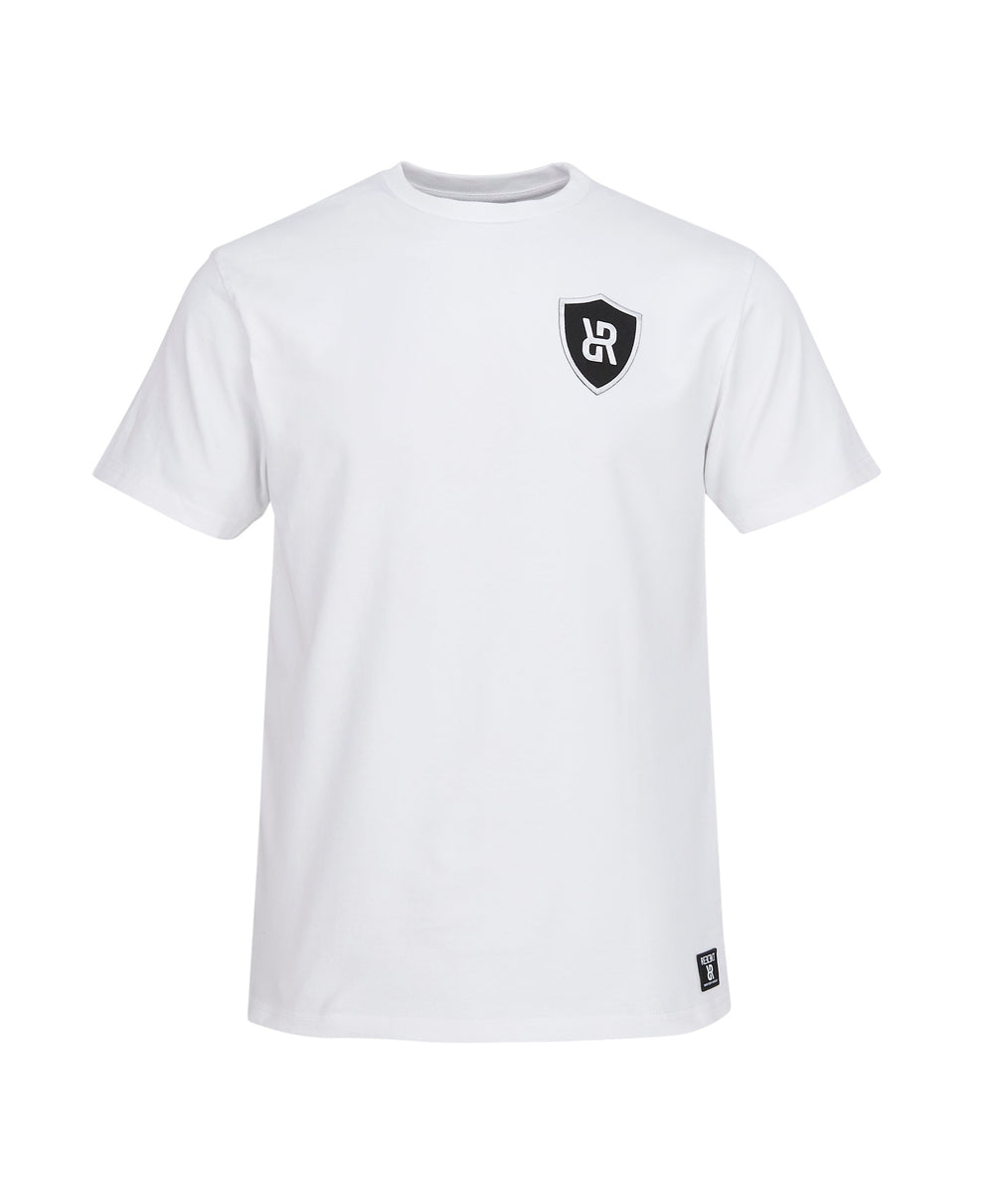 White REFLEKT T‑shirt with black shield logo on the chest and matching woven hem tag.