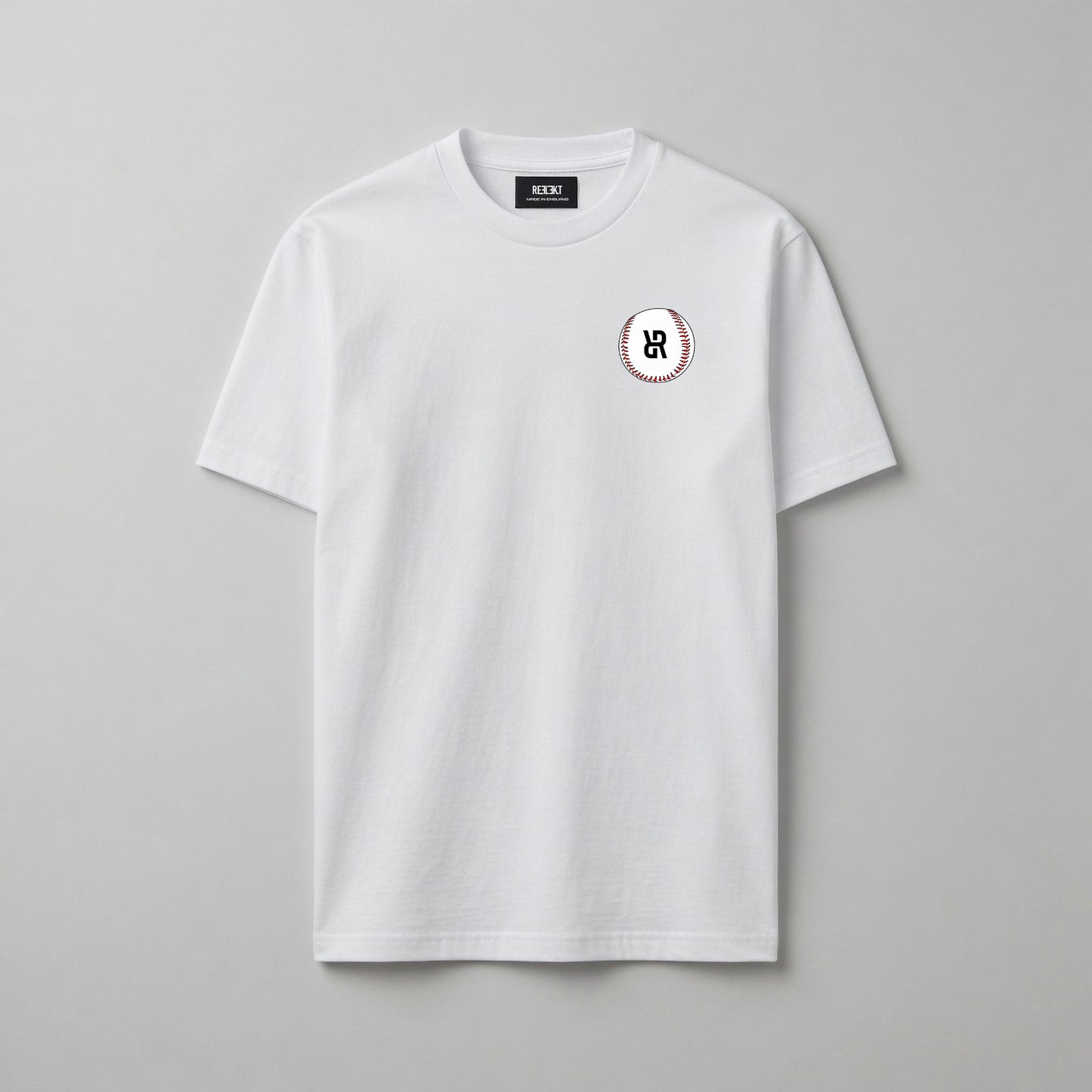 White t-shirt with a small baseball logo on a gray background