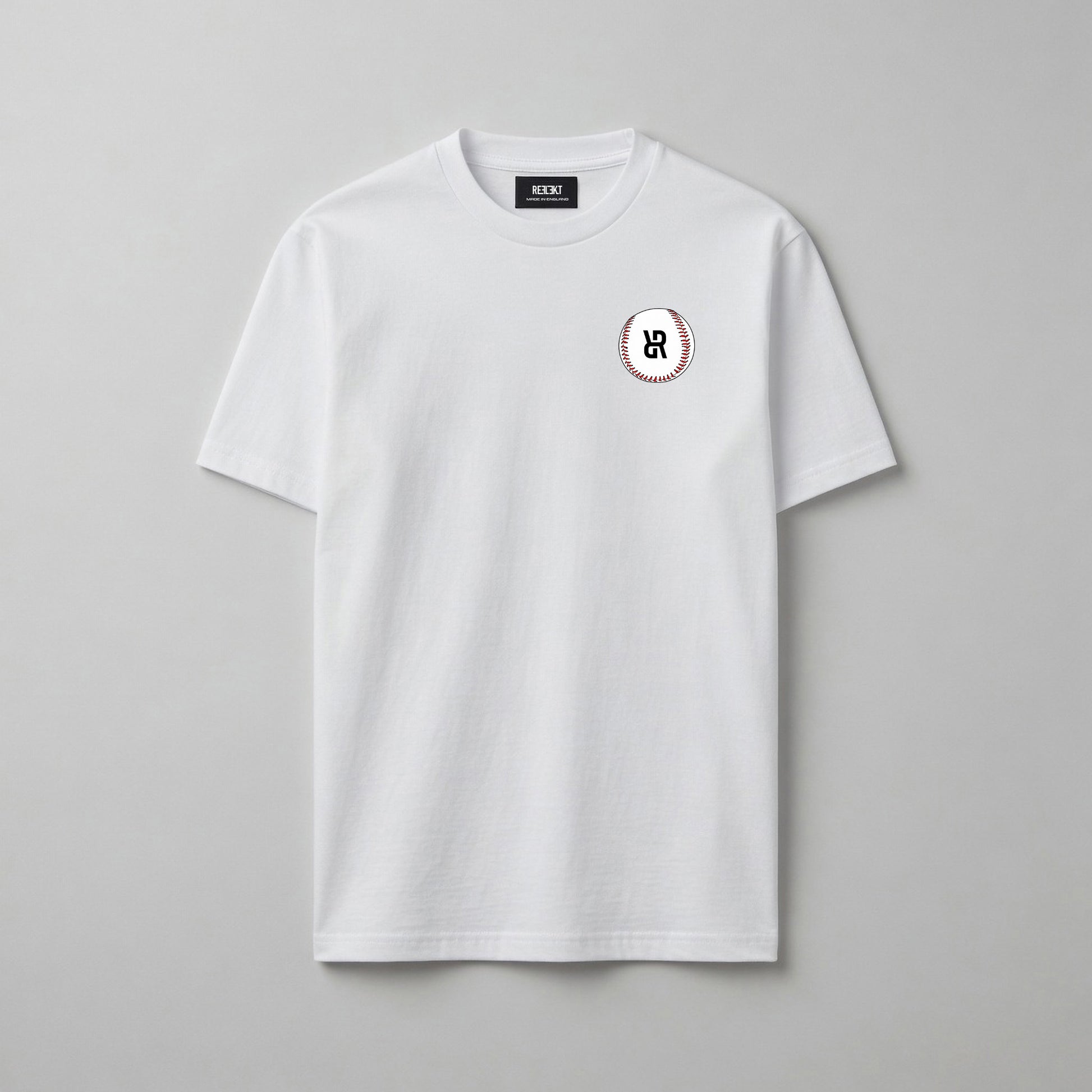 White t-shirt with a small baseball logo on a gray background
