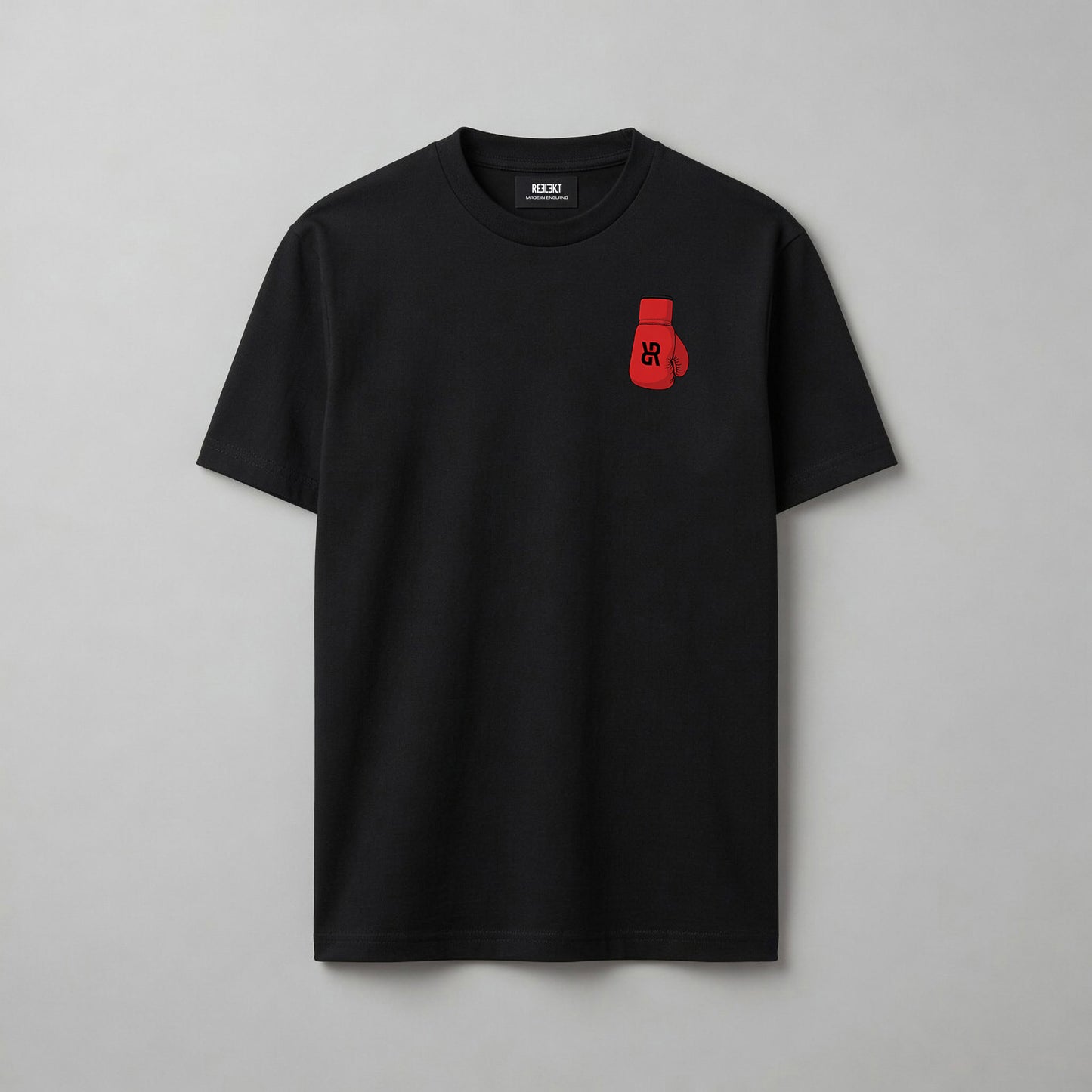 Black t-shirt with a red boxing glove logo design on a gray background