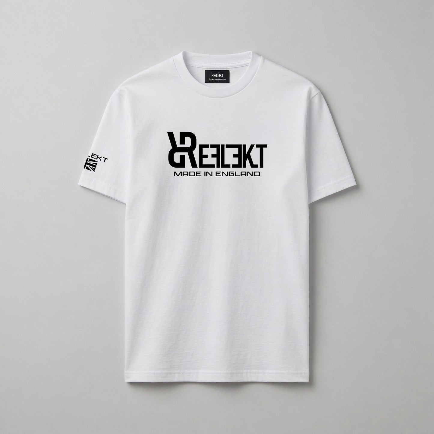 White t-shirt with black REFLEKT logo on a gray background