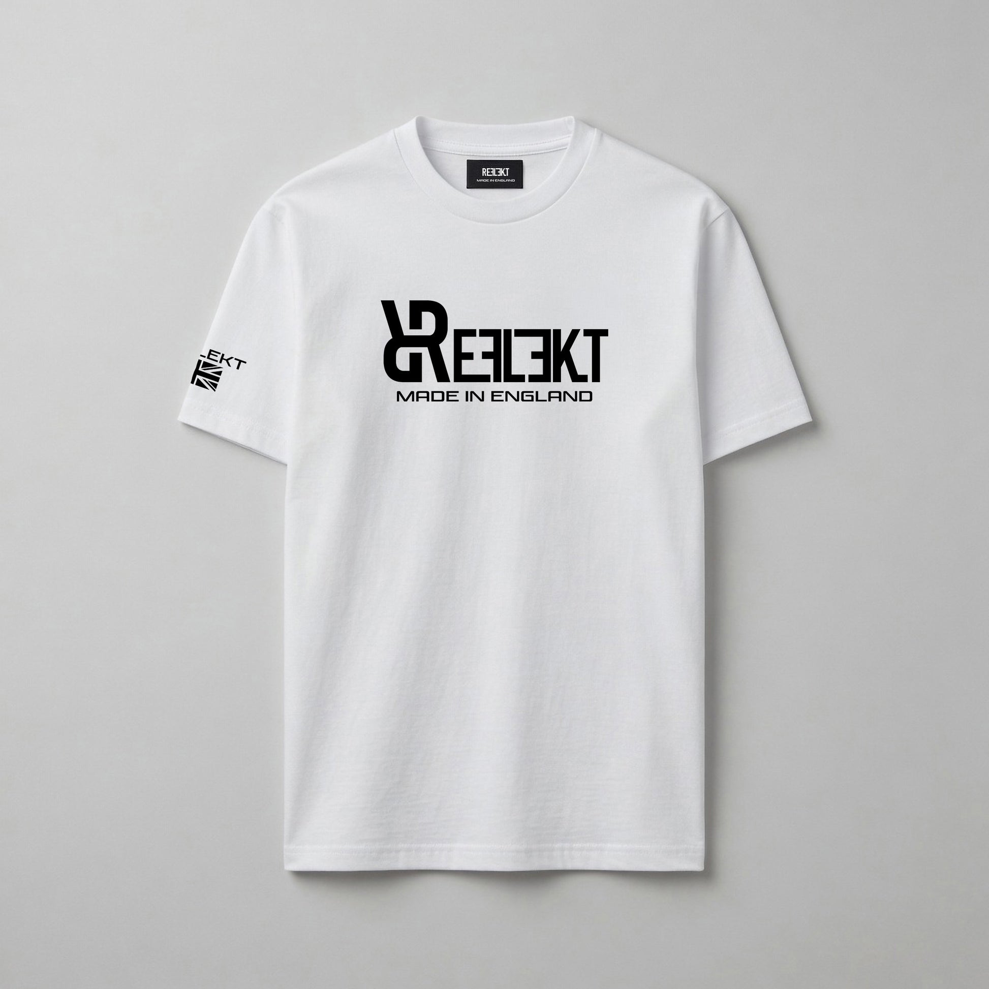 White t-shirt with black REFLEKT logo on a gray background