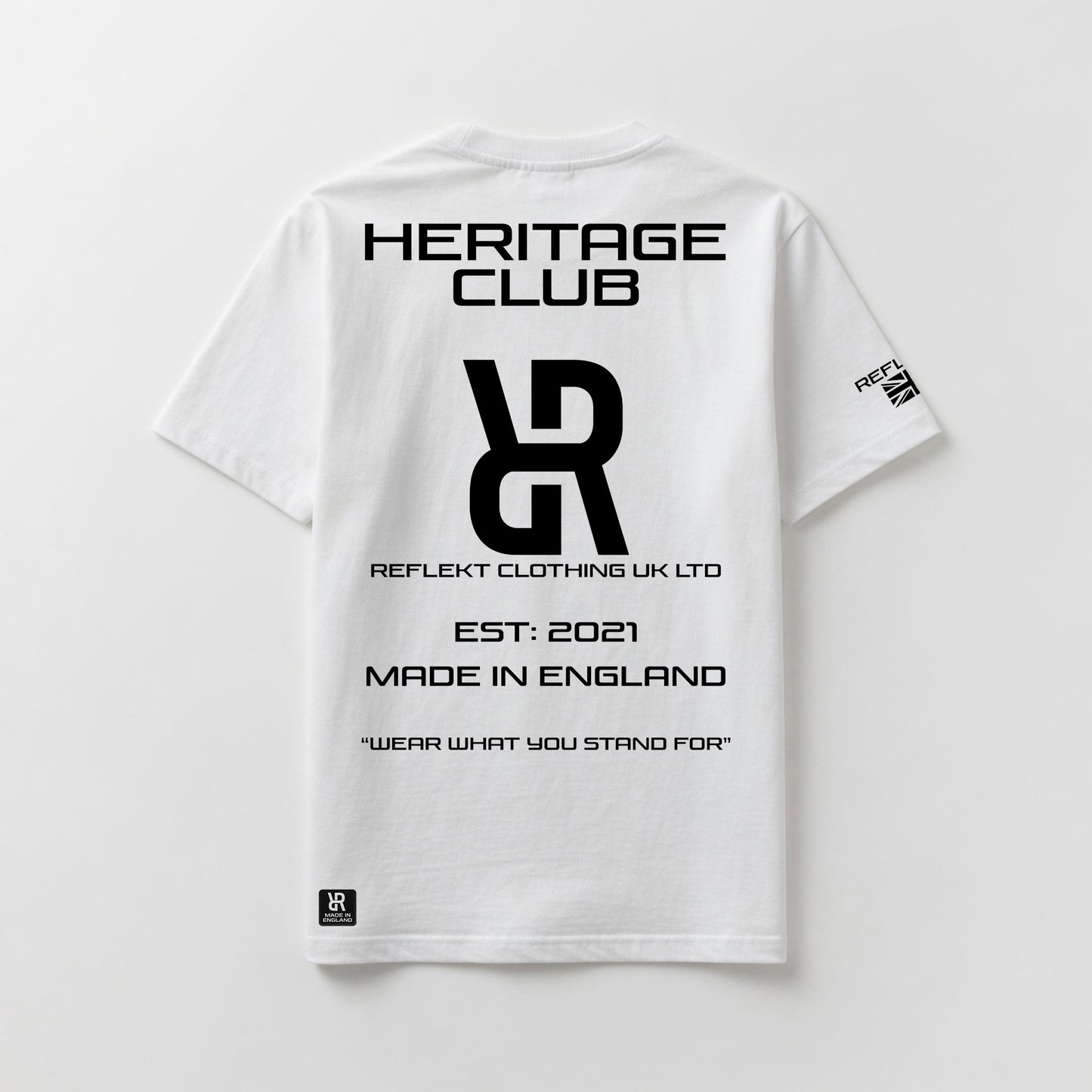 White t-shirt with black REFLEKT Heritage text and branding on a light gray background