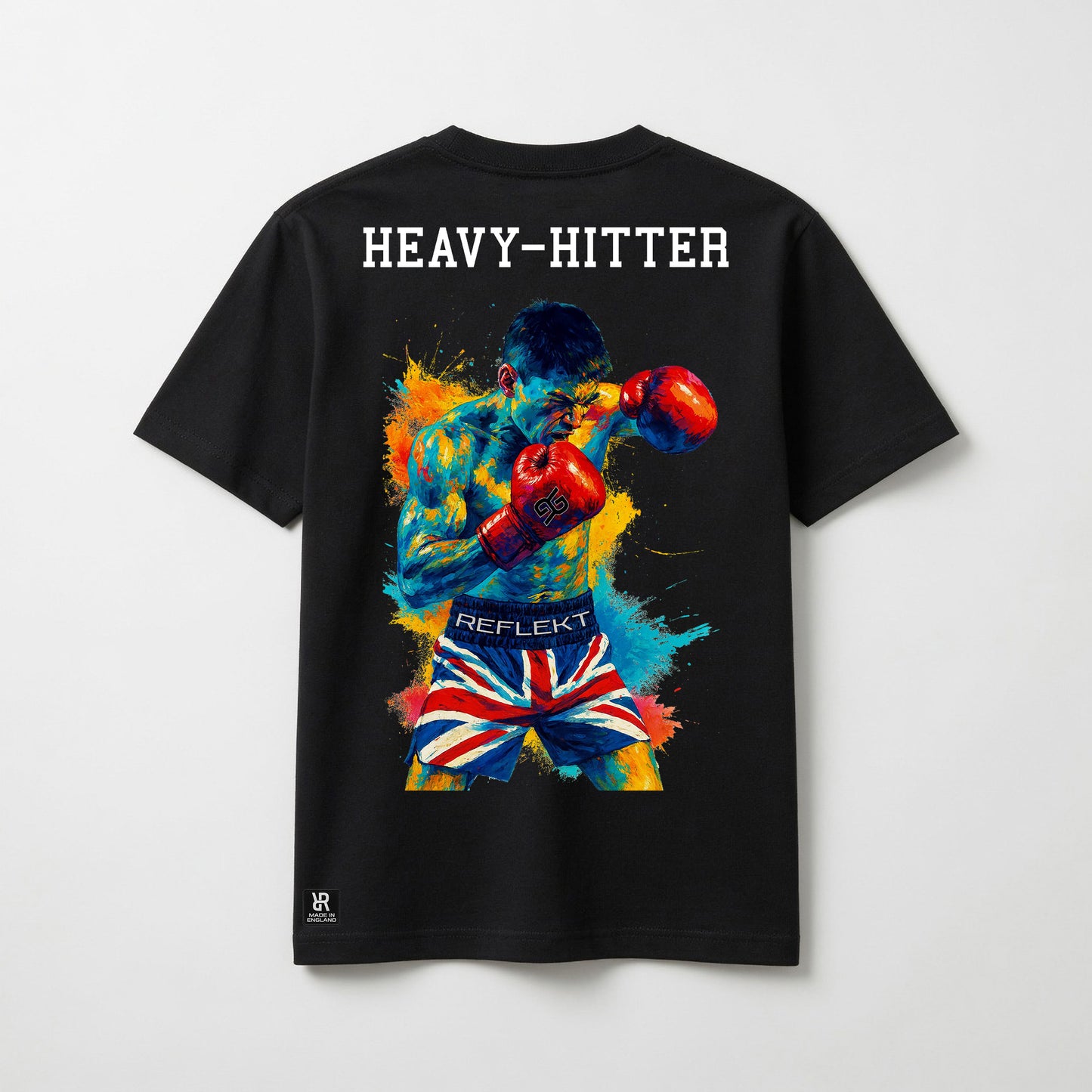 Black t-shirt with a colorful boxing graphic and 'HEAVY-HITTER' text on the back, displayed against a light gray background.