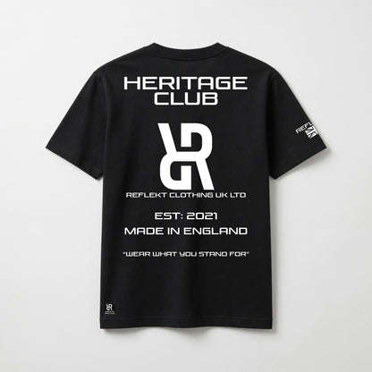 Black t-shirt with white REFLEKT Heritage text and branding on a light gray background