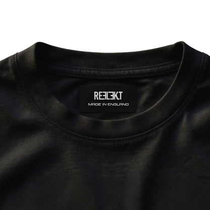 Black shirt with 'REFLEKT' brand label on a white background