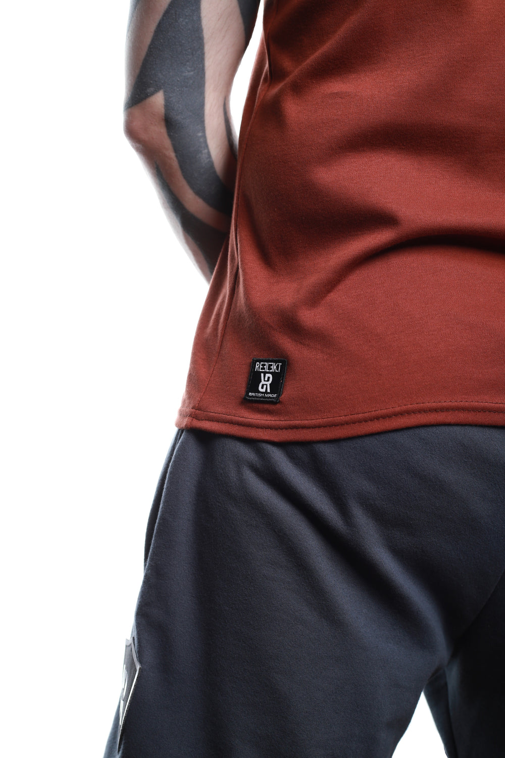 Insignia patch on back of Rust‑coloured REFLEKT Heritage T‑shirt.