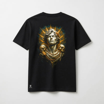 A black short-sleeve t-shirt with a large graphic print on the back featuring a classical bust, skulls, and a golden sunburst, displayed against a light gray background.