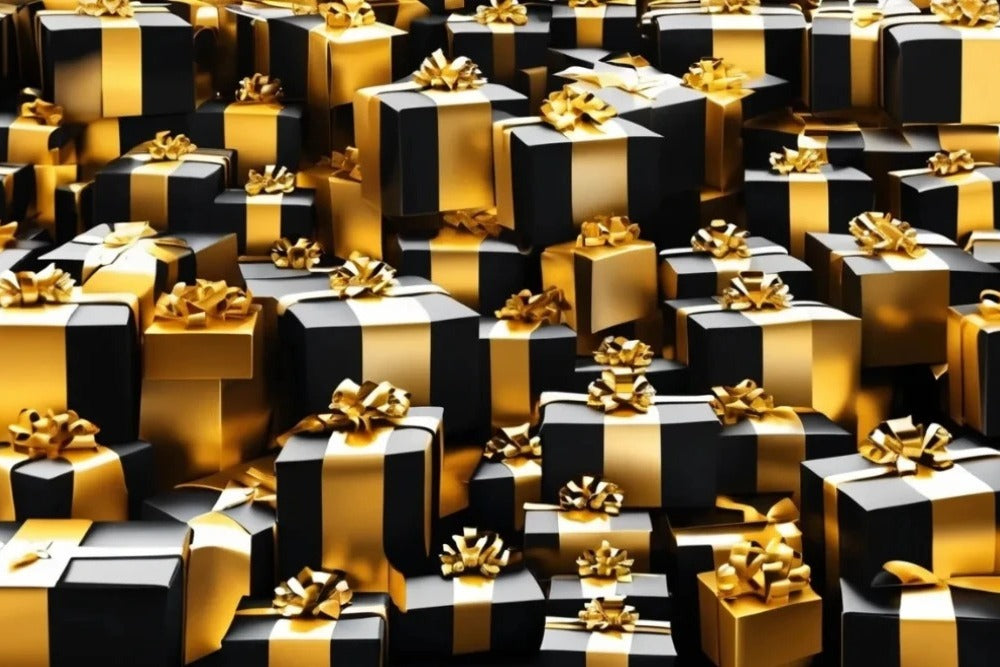 Black gift boxes with gold bows, representing REFLEKT Clothing gift cards.
