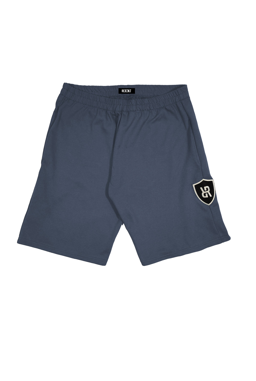 Charcoal REFLEKT Vanguard athletic shorts with large shield logo patch on the left side leg.