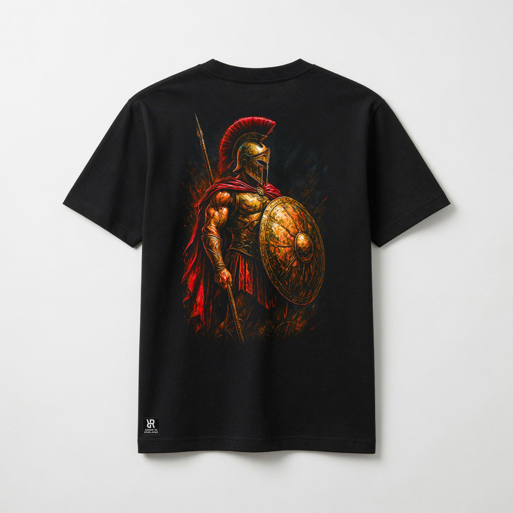 A black short-sleeve t-shirt with a large graphic print of a Spartan warrior holding a shield and spear on the back. The graphic features a red helmet plume and a red cape, with the warrior rendered in gold and bronze tones.