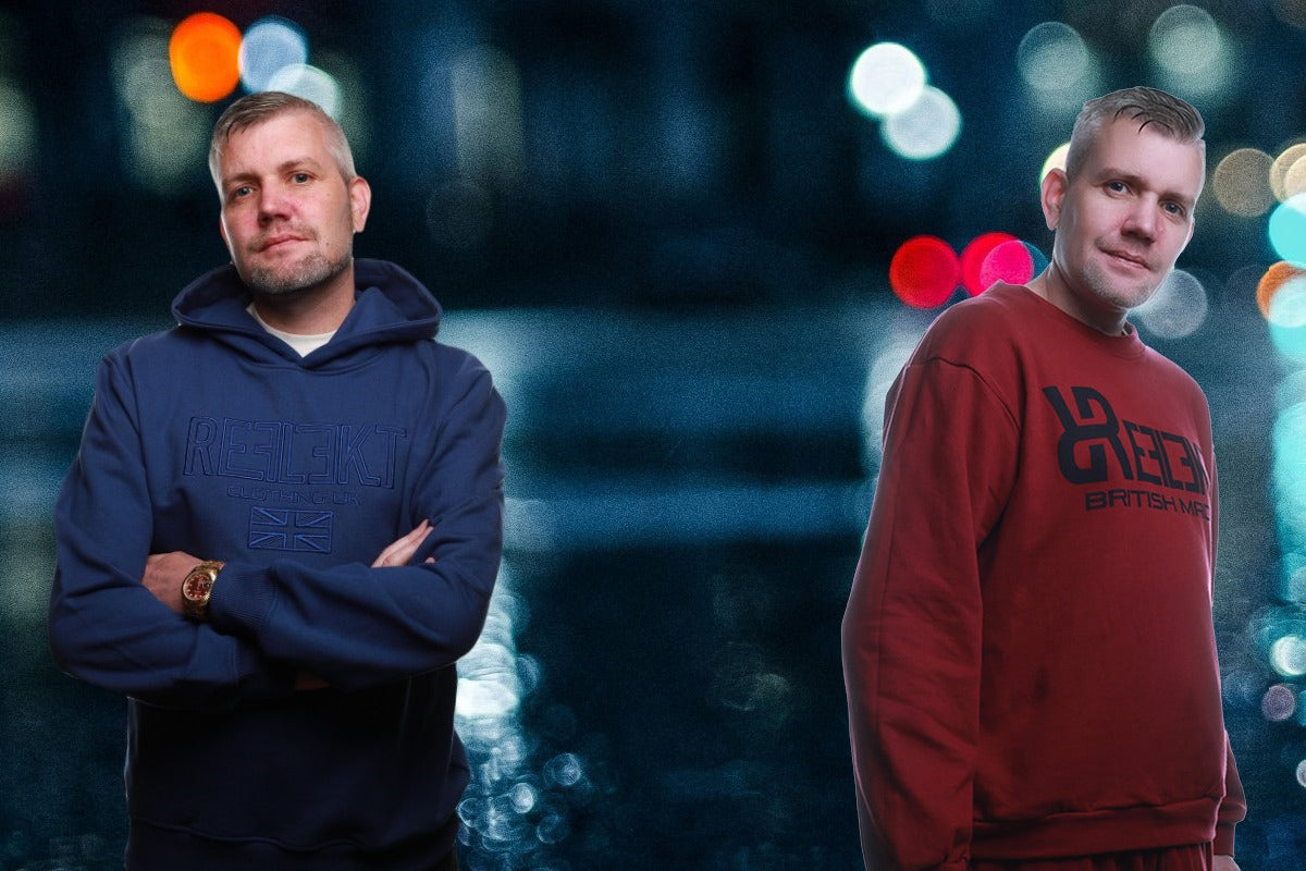 Two men standing side by side with a blurred colorful background